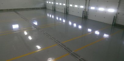 an image of the inside of a warehouse with epoxy flooring