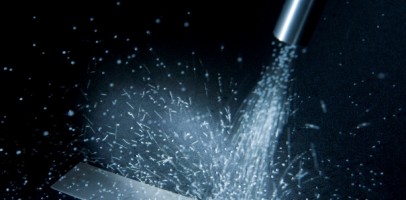 an image of shot blasting being used to clean a surface