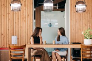 Image of two women having a work break